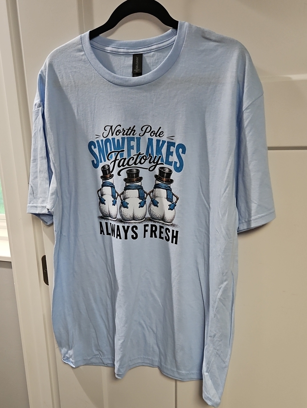Gildan Light Blue 'North Pole Snowflakes Factory' Snowman Graphic Tee